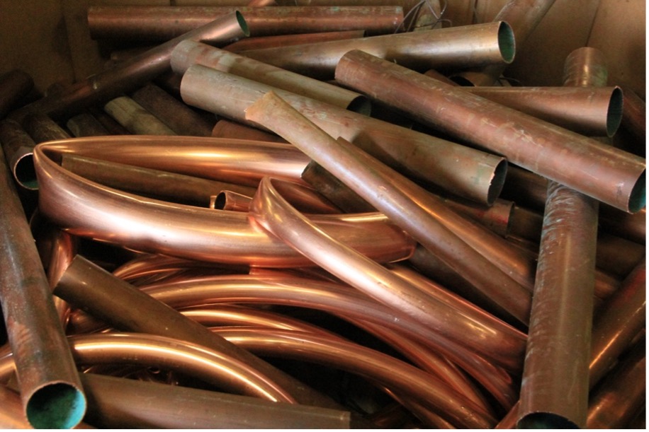 A pile of copper pipes