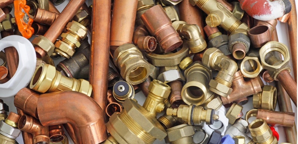 A pile of copper pipes and fittings