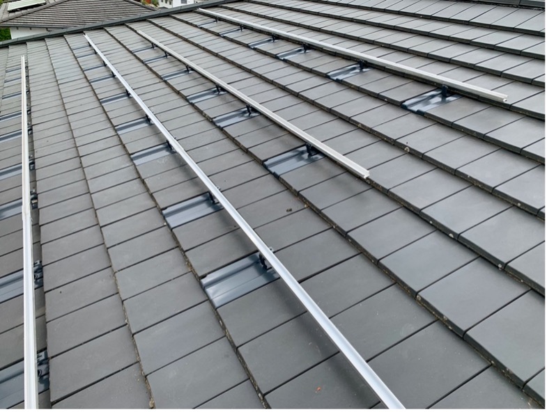 A roof with metal rails